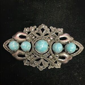 Ornate Silver Brooch with Turquoise Accents